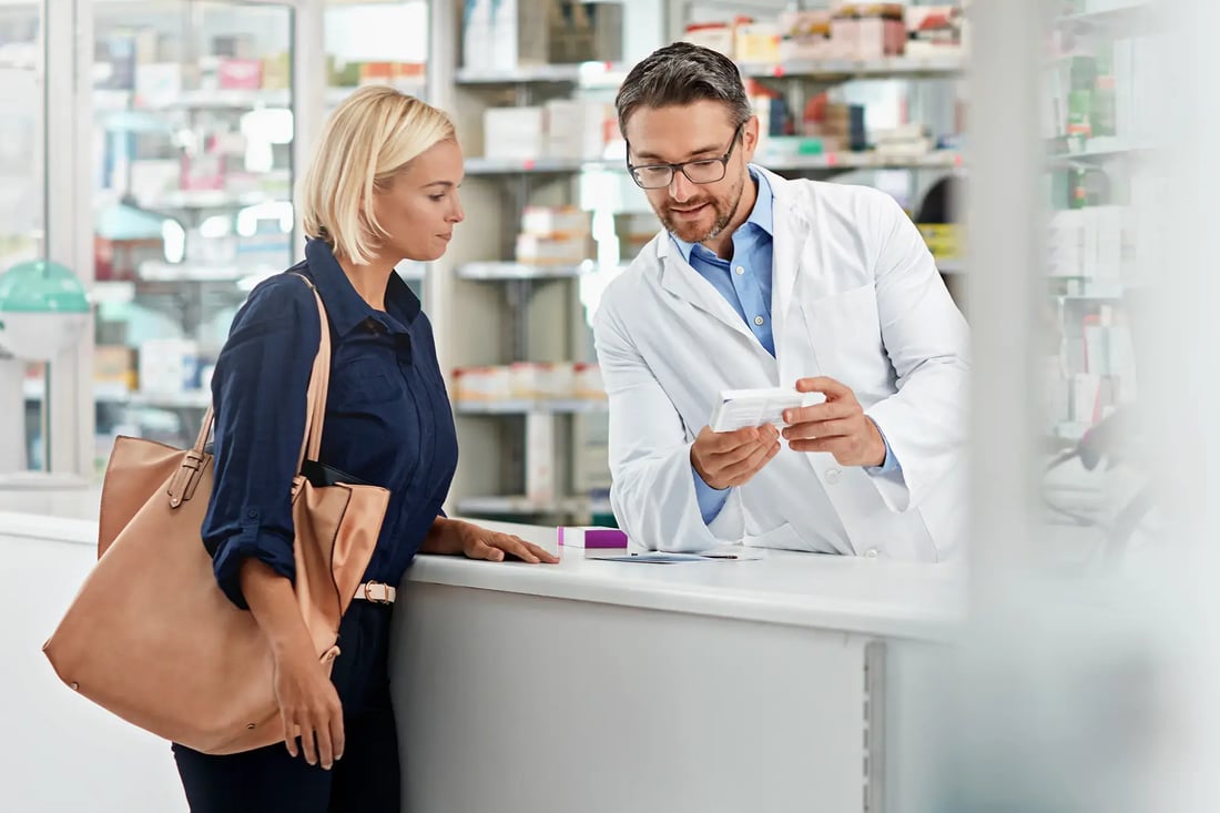 accommodating-pharmacist-explaining-medicine-prescription-and-refills-to-female-customer accommodating-pharmacist-explaining-medicine-prescription-and-refills-to-female-customer