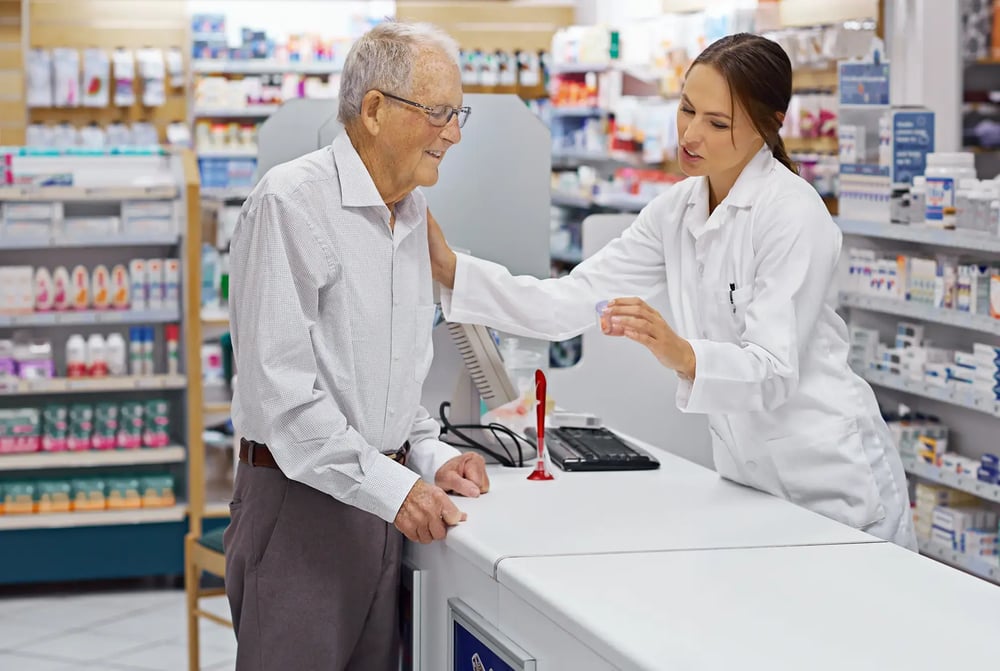 accommodating-pharmacist-explaining-medicine-prescription-and-refills-to-old-patient accommodating-pharmacist-explaining-medicine-prescription-and-refills-to-old-patient